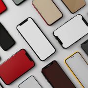Multiple smartphones with different designs and colors arranged on a white background.